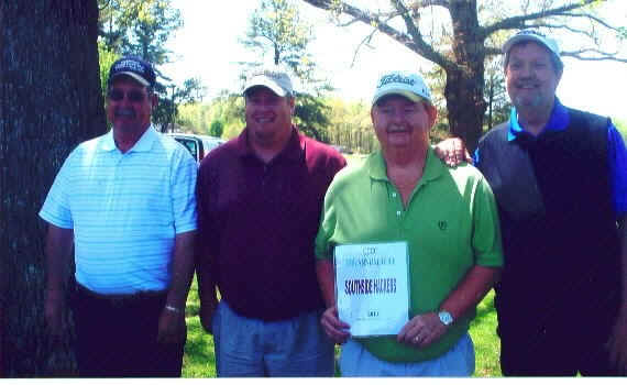 Four golfers at the Chase City Chamber golf tournament